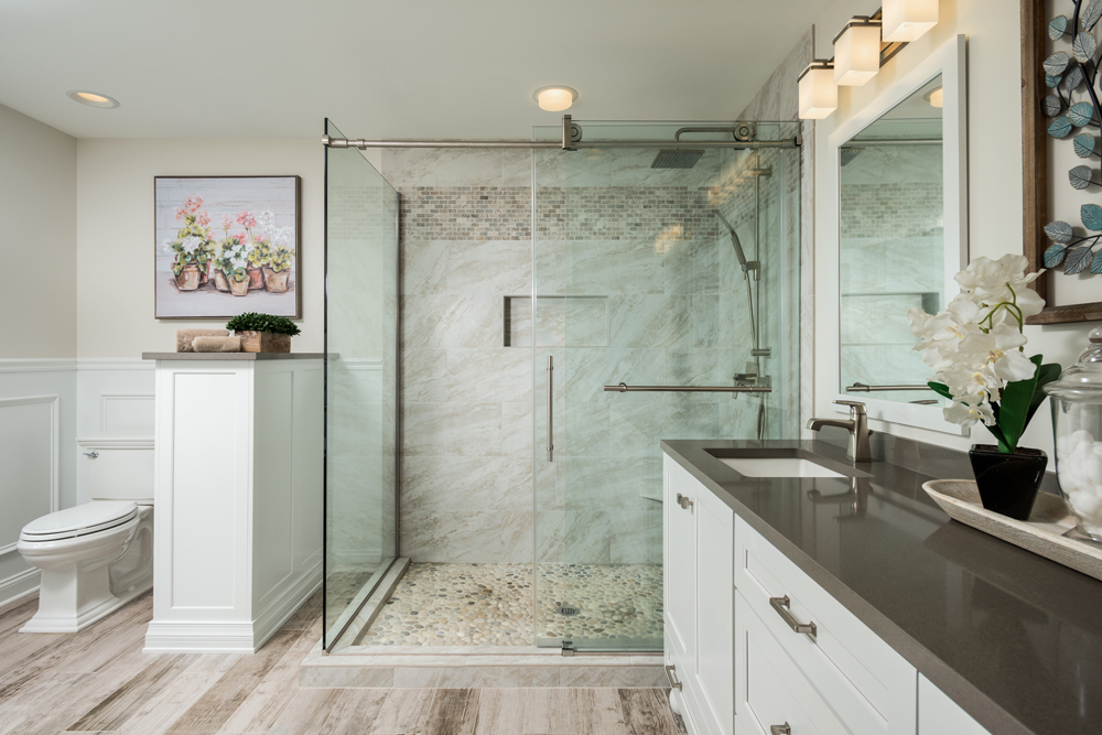 brown and grey bathroom with glass shower Kitchen and Bath World